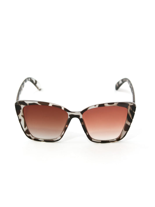 Gafas de sol estilo ojo de gato, marco animal print con lente café degradado.